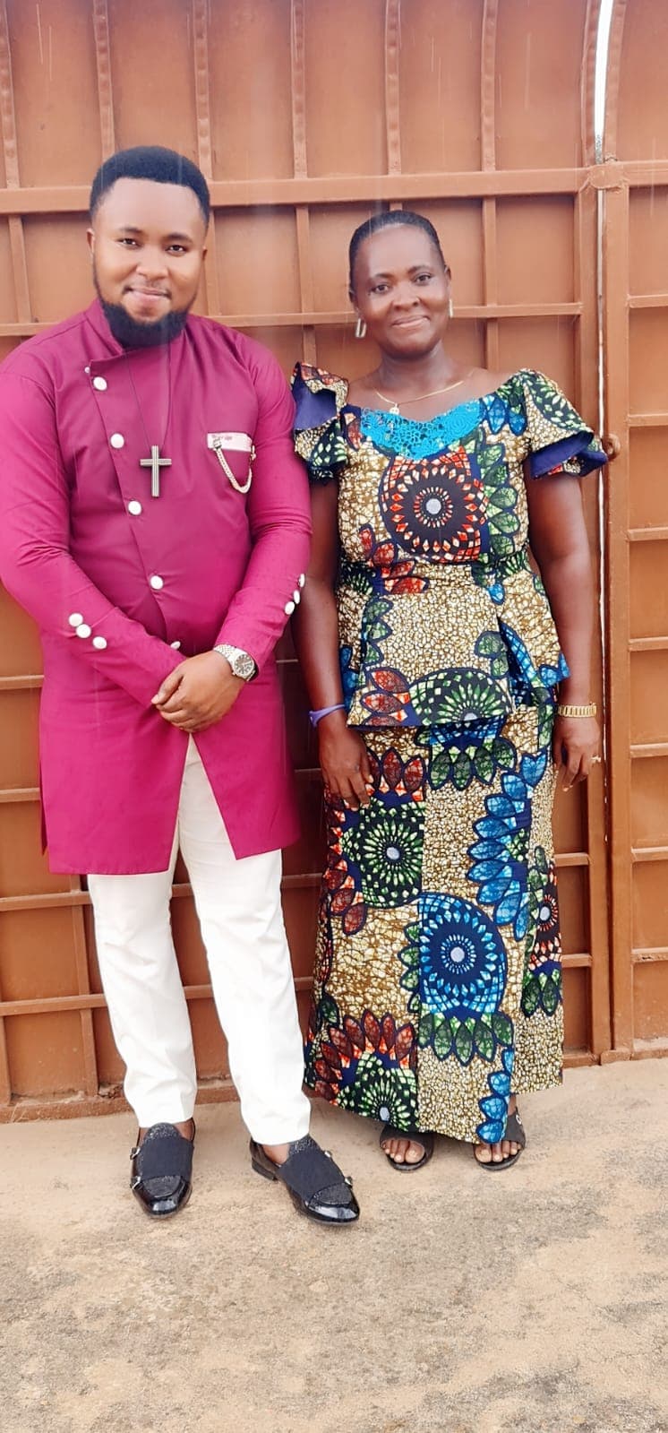 Prophet William Osei with a member of the DAG Foundation community.